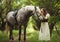 Beautyful woman with horse in Ukrainian national dress.