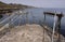 Bec du Nez, Jetty Edge with Mooring Ropes and Ladder, View of Coast, Fermaine Bay and Saint Peter Port Fort, Guernsey.