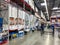 The bed aisle of a Sams Club with variety of mattresses ready to be tried out and purchased by consumers