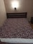 Bed with bedsheet cover mattress in bedroom