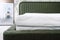 bed with comfortable mattress in bedroom, closeup