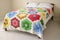 Bed with floral quilt