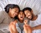 Bed, fun and happy family playing, wake up and happy from above, tickle and laughing in their home. Bedroom, games and