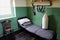 Bed and kit belonging to a WW1 soldier in a restored army barracks room