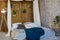 Bed in the loft style. The wall of wooden rails. Interior in Loft style