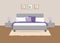 Bed with purple and white pillows and bedside tables