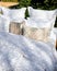 Bed with white patterned linen in the garden in the summer