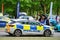 Bedford, Bedfordshire, UK June 2 2019.Police Vehicle responds to an emergency on a city center street during special event