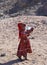 Bedouin children entertain tourists. Kids of the Sahara desert. An aboriginal child with a bottle of water