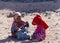 Bedouin children entertain tourists. Kids of the Sahara desert. Release from the leash