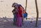 Bedouin children entertain tourists. Kids of the Sahara desert. Selfies with babies in Africa