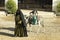 Bedouin life. An elderly woman entertains tourists.