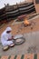 A Bedouin Prepares Bread by the Fire in Wahiba Sands in Oman