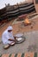 A Bedouin Rolls Bread in Wahiba Sands in Oman