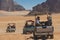 Bedouin`s car jeeps and tourists, Wadi Rum desert in Jordan, Middle East