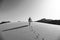 Bedouin Walking on the Sand Dunes in Wadi Rum Desert, Jordan in Black and White