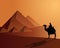 Bedouins aboard a camel near the pyramids
