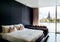 Bedroom with black wall white bed, pillows couch, lamp. Bay wind