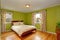 Bedroom with bright neon green walls