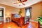 Bedroom with Brown walls and cherry hardwood