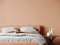 Bedroom in delicate peach fuzz room color trend 2024 year panton furniture