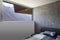 Bedroom detail with bed and pillow, large window overlooking the Swiss Alps