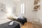 Bedroom with double beds, gray carpet, shared wooden nightstand,