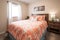 bedroom, with freshly laundered linens and reading glasses on nightstand