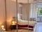 Bedroom with mirrored wardrobe