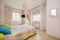 bedroom with pink walls and pretty floral lamp