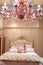 Bedroom with red chandelier