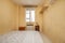 Bedroom with sofa, white aluminum window, wooden nightstands