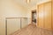 Bedroom in a two-story loft with stairs, chestnut wood flooring