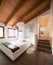 Bedroom with wooden beams, elegant and modern.