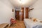 bedroom with a youth bed with fitted wardrobes and herringbone oak parquet floors