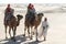 Beduin leading tourists on camels