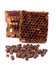 Bee bread granules and a piece of honey cells are isolated on a white background. Natural remedy for immunity enhancement. Beekeep