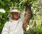 Bee keeper with a swarm of bees