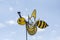 Bee-shaped yellow weather vane