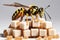 A bee sits on brown sugar cubes