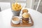 Beed Sliders with french fries and mayo dip served in a dish isolated on grey background top view