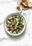 Beef, beans, spinach stew on a light background. Delicious homemade comfort food