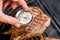 Beef blade steak grilling on barbecue grill plate with meat thermometer. Backyard BBQ grill cooking