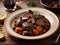 Beef Bourguignon, delicious French dinner dish of slow cooked beef in a red wine sauce, mushrooms