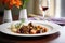 beef bourguignon plated on fine china with red wine