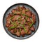 Beef Bulgogi on black plate isolated on white. Korean cuisine meat dish with sauce and kiwi. Traditional asian food