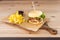 Beef burger with melted cheese, a slice of Iberian ham, lamb\\\'s lettuce