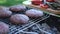 Beef burgers cutlets are roasting on the charcoal barbecue grill