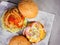 Beef burgers with red and yellow peppers, napa cabbage, tomato and cheddar.