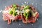 Beef carpaccio appetizer with baby asparagus